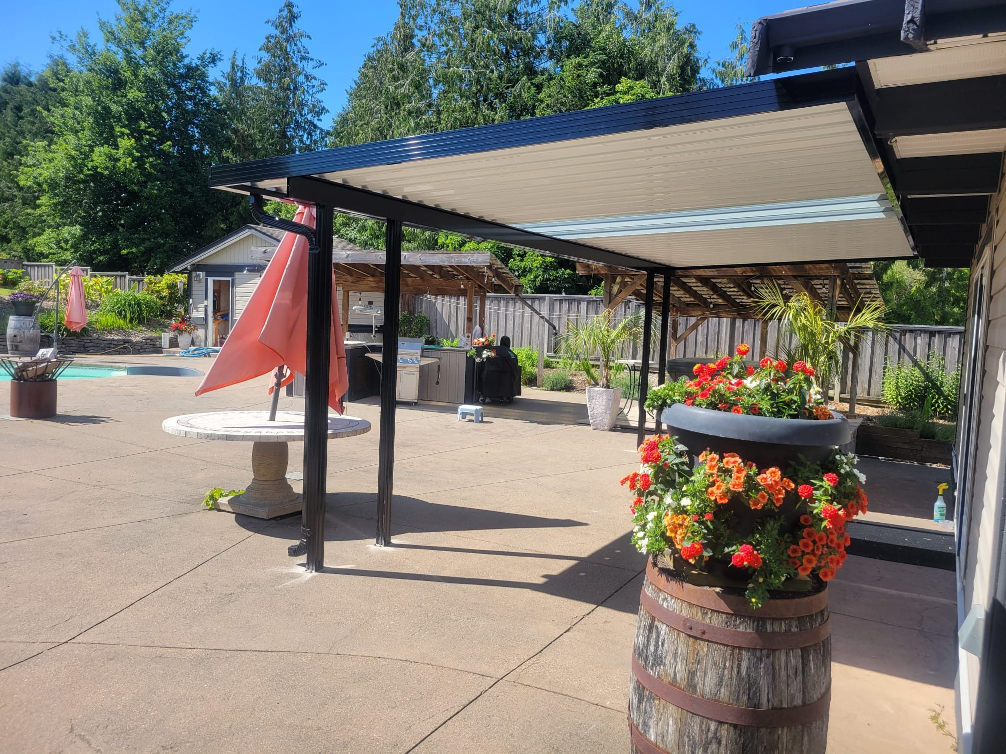 Aluminum patio cover over a poolside patio with outdoor kitchen, Lower Mainland