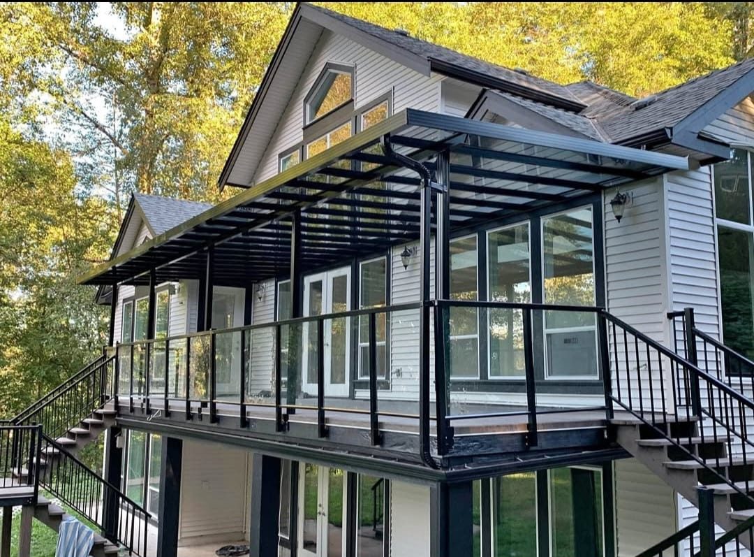 Glass and aluminum pergola cover over a two-storey home deck